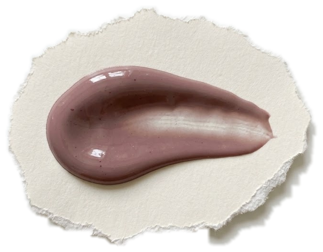 A scoop of Forager Project blueberry cashew yogurt swirled across a torn-edge paper disc, showing its smooth glossy texture
